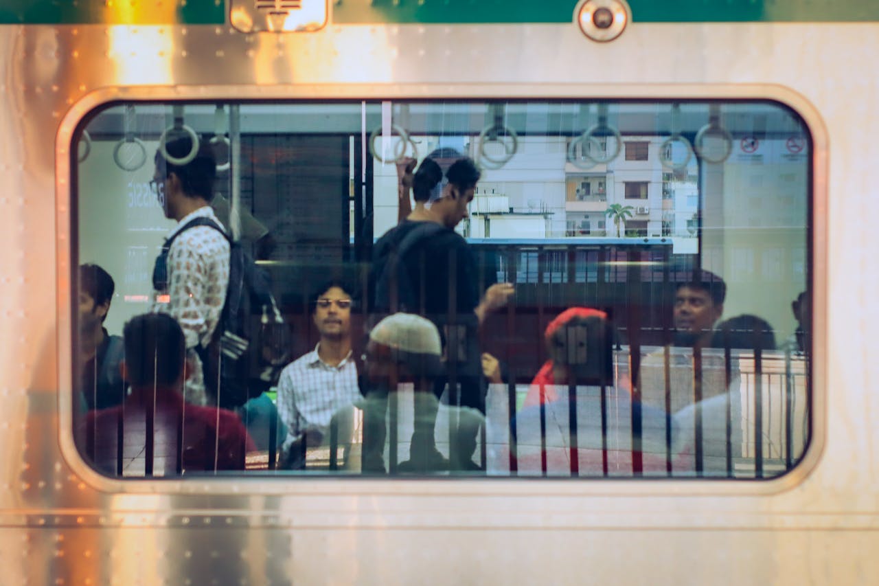passengers-on-train-viewed-through-window-34059824